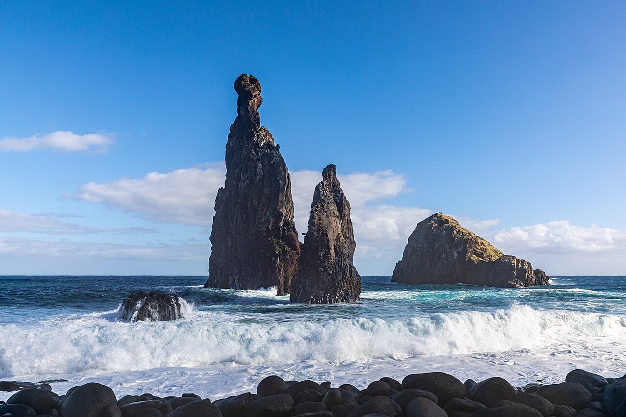 Sea stacks rise above the surf at Ribeira da Janela, the rocky coast reached on a shoreline visit.